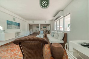 Apartment, Multiple Beds, Kitchen, Beach View (Basilio Badillo 261A) | Living area | 42-inch flat-screen TV with digital channels