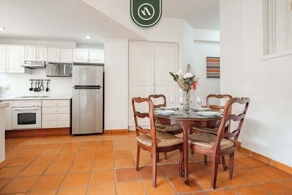 Apartment, Multiple Beds, Balcony, Ocean View (One Beach Street 310 C) | Private kitchen | Coffee/tea maker, dining tables