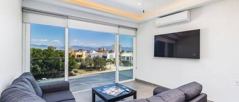 Condo, Multiple Beds, Kitchen, Pool View (Believe Condo Flamingos Believe 302) | Living area | 42-inch flat-screen TV with digital channels