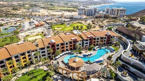 A resort with a central pool, multiple buildings, and a golf course. - Two Bdrm House With Ocean View in Cabo (Cabo San Lucas)