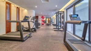 A gym with treadmills, weight machines, and exercise balls. - Amazing 2BR Apt -private Balcony - Rooftop Pool (Puerto Vallarta)