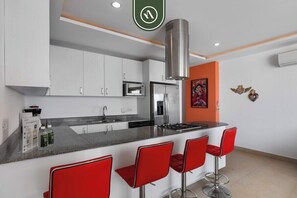 Condo, Multiple Beds, Pool Access, Ocean View (The Park 406) | Private kitchen | Coffee/tea maker, dining tables