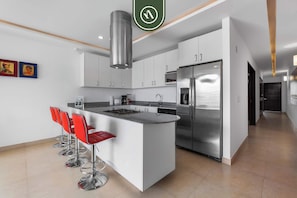 Apartment, Multiple Beds, Kitchen, Ocean View (The Park 406) | Private kitchen | Coffee/tea maker, dining tables