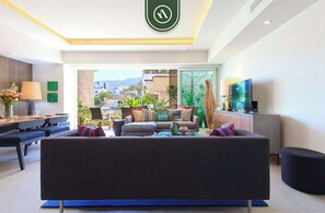 Apartamento, 1 cama King, cozinha, vista para a praia (V Estrella - 104) | Área de estar | TV de tela plana 42 polegadas com canais digitais