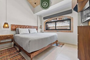 Apartment, Multiple Beds, Kitchen, Pool View (Bliss 450 2-5) | 2 bedrooms, individually decorated, individually furnished, bed sheets - Restored Historic 2 BR Condo in Downtown - Pool (Puerto Vallarta)