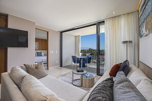 Condo, varias camas, cocina, vista a la alberca (MIO RESIDENCES 306 ABC-3BR) | Área de sala de estar | Televisión de pantalla plana de 42 pulgadas con canales digitales 