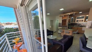 A modern apartment with a balcony, a dining area, and a kitchen. - Luxury & Location, Beautiful Apartment in Los2Caminos-Boleita (Caracas)