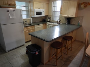 Fridge, microwave, stovetop, coffee/tea maker