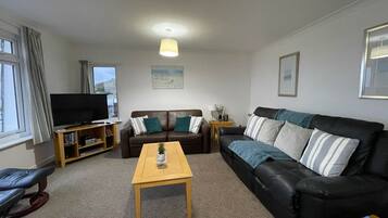 Apartment, 2 Bedrooms | Living area | 32-inch TV with digital channels, DVD player