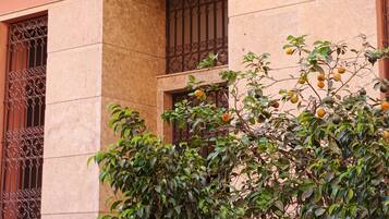 A building with a sign reading 'Residence Rachidi' above a gated entrance.