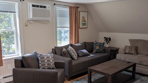 A modern living room with a sofa set, a coffee table, and a rug. - Perfectly Located 1 Bedroom, newly remodeled  (Augusta)