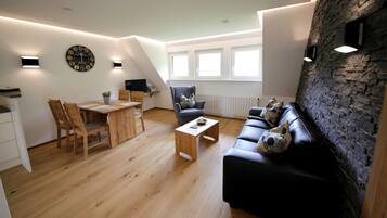 Televisie, een dvd-speler, een tafeltennistafel en een stereo