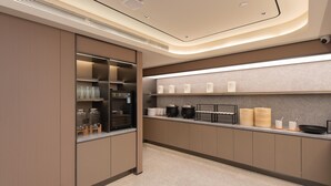 A modern kitchen with built-in appliances, a stainless steel refrigerator, and a countertop with various kitchenware. - Ji Guangzhou Beijing Road Pedestrian St Cangbian (Guangzhou)