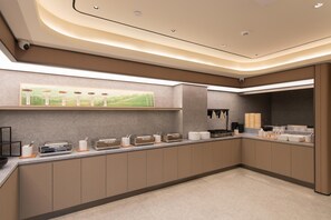A modern kitchen with a long counter, equipped with various appliances and utensils, and a wall-mounted shelf with decorative items. - Ji Guangzhou Beijing Road Pedestrian St Cangbian (Guangzhou)
