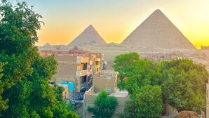A view of the pyramids with surrounding buildings and greenery. - Vysta pyramids hotel Cairo 
View pyramids 
renovated rooms
Restaurant with view (Giza Governorate)