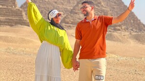 Two people standing in front of a pyramid with their arms raised. - Vysta pyramids hotel Cairo 
View pyramids 
renovated rooms
Restaurant with view (Giza Governorate)