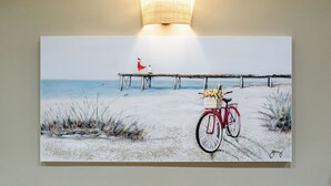 A beach scene with a bicycle and a pier. - Santo Spirito: Florence's Residential Soul apartment (Firenze)