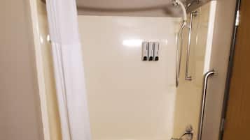 A bathroom with a bathtub, a shower, and a toilet.