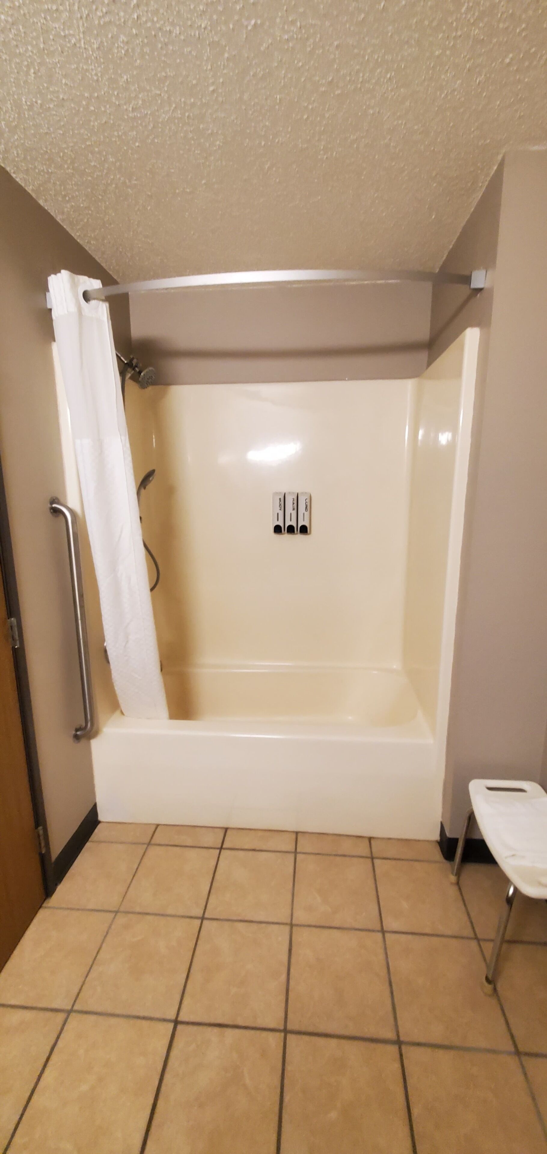 A bathroom with a bathtub, a shower, and a toilet.