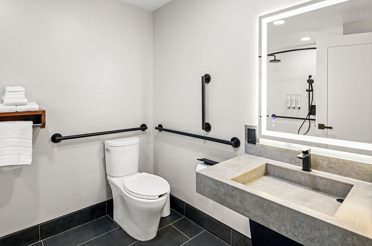 Premier Single Room, Accessible | Bathroom | Shower, eco-friendly toiletries, hair dryer, slippers