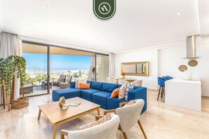 Apartment, Multiple Beds, Balcony, Ocean View (Mistiq 320) | Living area | 42-inch flat-screen TV with digital channels - Luxury 2 BR Condo - Oceanview Pool - Gym (Cabo San Lucas)