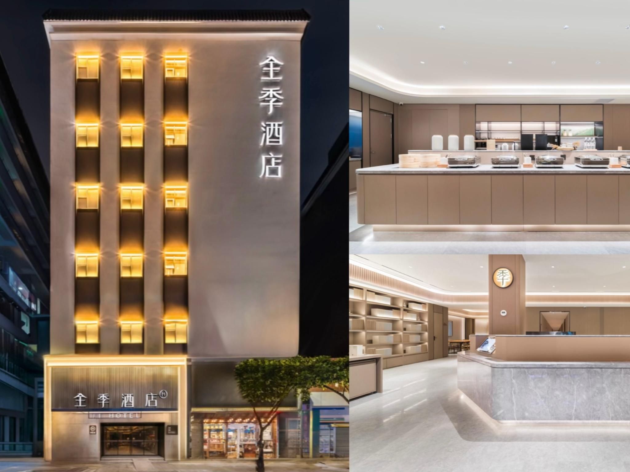 A hotel with a modern facade and a well-lit interior.