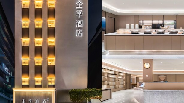 A hotel with a modern facade and a well-lit interior.