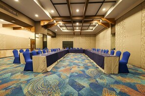 A conference room with a long table, blue chairs, and patterned carpet. - The Orchid Hotel, Pune (Pune)