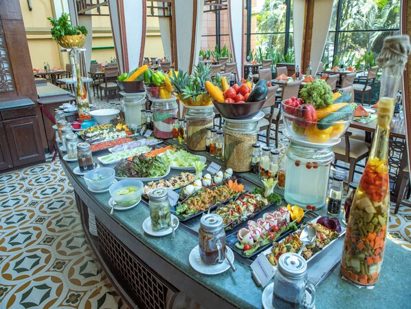 A buffet with various food items and condiments. - The Orchid Hotel, Pune (Pune)