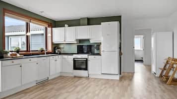 Fridge, stovetop, dishwasher, coffee/tea maker