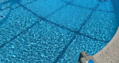 3-bedroom house in Jacksonville with fenced backyard and screen enclosed pool.