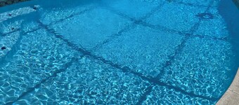 3-bedroom house in Jacksonville with fenced backyard and screen enclosed pool.