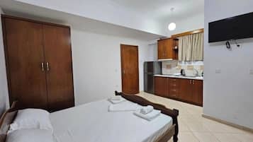 Economy Studio, Balcony, Garden View | Iron/ironing board, free WiFi