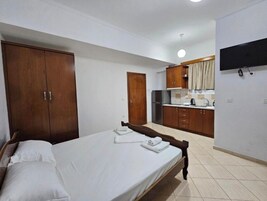 Economy Studio, Balcony, Garden View | Iron/ironing board, free WiFi