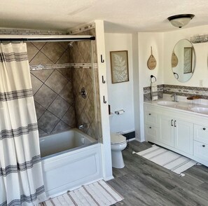 Jetted tub, hair dryer, towels, soap