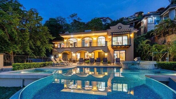 A large, two-story building with a swimming pool in front. - Playa Hermosa Hillside Villa • 5BR • Sleeps 12 • Infinity Pool & Bay View • Casa Ilan Ilan (Playa Hermosa)
