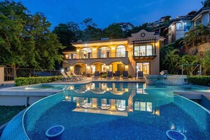A large, two-story building with a swimming pool in front. - Playa Hermosa Hillside Villa • 5BR • Sleeps 12 • Infinity Pool & Bay View • Casa Ilan Ilan (Playa Hermosa)