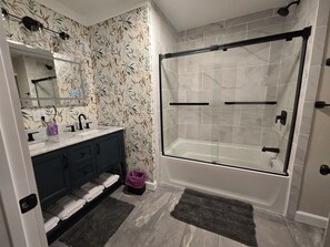 Shower, hair dryer, towels, soap