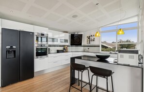 Fridge, stovetop, dishwasher, coffee/tea maker