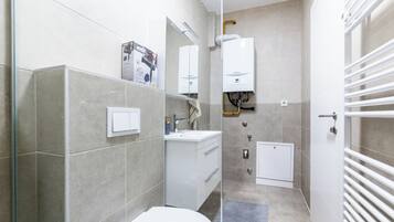 Luxury Apartment, City View | Bathroom | Hair dryer, towels, soap, shampoo