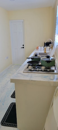 Comfort Apartment, Partial Ocean View | Private kitchen. Oceanview Suites