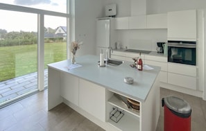 Fridge, stovetop, dishwasher, coffee/tea maker