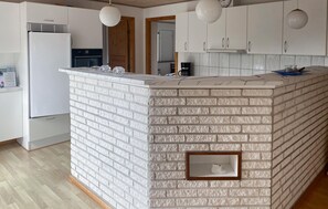 Fridge, stovetop, dishwasher, coffee/tea maker