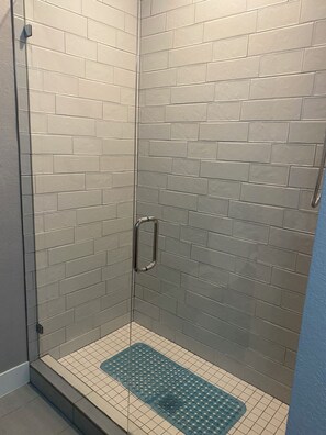 Shower, hair dryer, towels, toilet paper