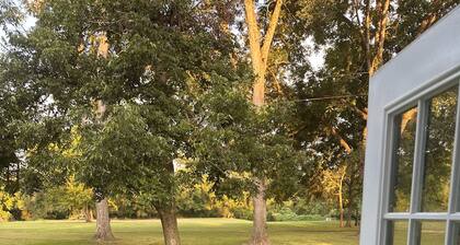 Historic cottage privately situated on the grounds of the Foster Mounds.