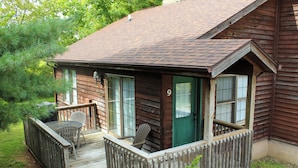 A wooden cabin with a porch, a green door, and a number '9' on the side. - Minutes from Giant City - SIU - Shawnee Winetrail - Shawnee Forest - Cedar Lake (Makanda)