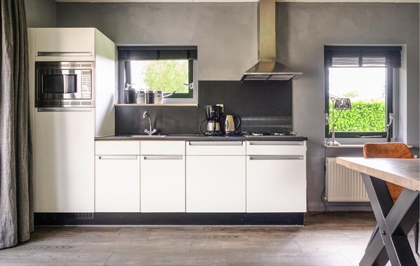 Fridge, stovetop, dishwasher, coffee/tea maker