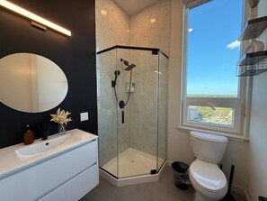 Shower, hair dryer, towels, soap