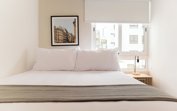 Apartamento tradicional | Wi-Fi de cortesia, roupa de cama