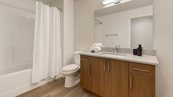 Combined shower/tub, hair dryer, towels, soap